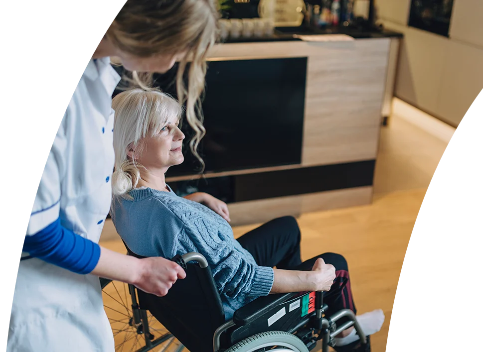 Support worker assisting a woman at home